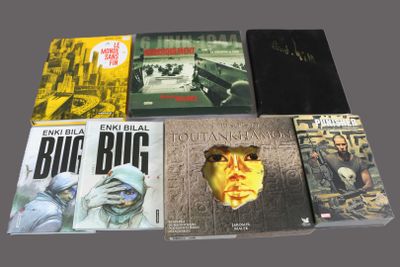several books are sitting on a table next to each other