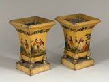 two vases that have been painted with people on them