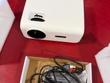 a box that has a projector in it on a table