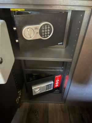 a safe box with a combination lock and a key on it