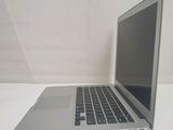 a laptop computer sitting on a table with a white background