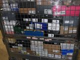 a metal cart with many boxes on it in a warehouse