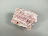 a piece of pink rock that is on a table