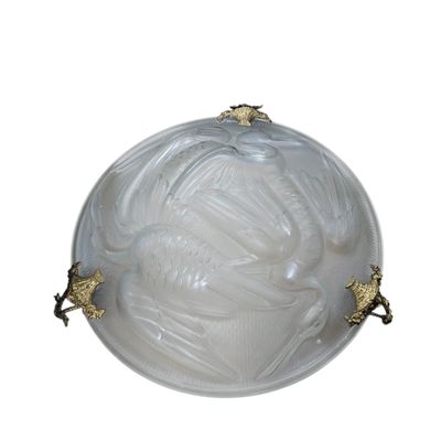 an image of a white glass ball with gold accents