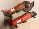 pair of old rusty pipe cutters on a white surface