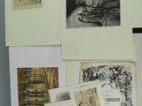 many drawings and pictures on the wall of a room