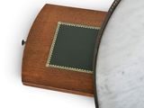 a mirror and a wooden box on a white surface