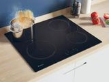 a stove top with a pot on it and a pan on the stove