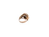 an image of a gold ring with a black stone in it