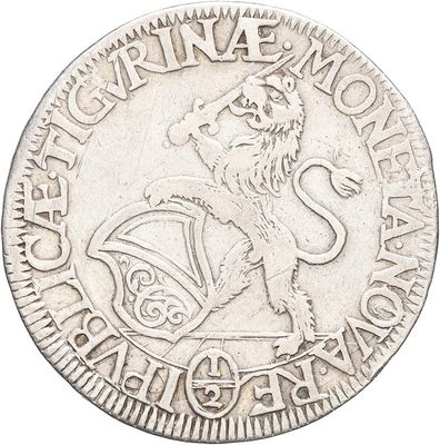 a close up of a silver coin with a dragon on it