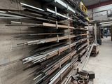 a large amount of steel bars stacked up in a warehouse