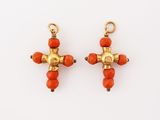 a pair of coral and gold earrings
