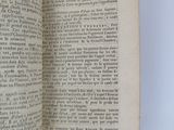 an open book with a black and white image of a man ' s hand holding a book