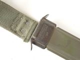 a close up of a knife on a belt