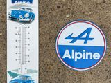 a sticker with a picture of a car and a thermometer on it