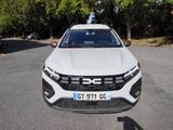the front end of a white suv parked in a parking lot