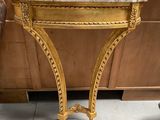 a table with a marble top and a chair next to it