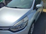the silver car is parked in the parking lot next to other cars