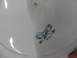 a white plate with a blue and white design on it