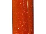 a red liquid in a silver container on a white background