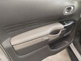 the interior of a car with the door open and the door handle open