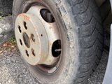 a close up of a flat tire on a car