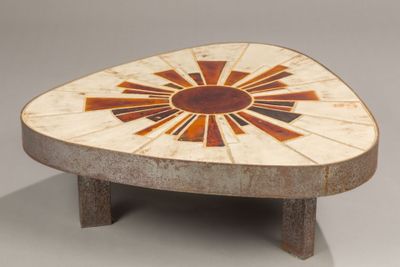 a small table with a geometric design on it