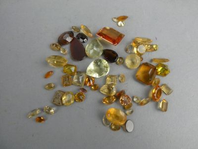 a lot of different colored stones on the table