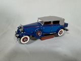 a toy car that is sitting on a white surface