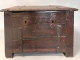 an old wooden chest with a lock on it