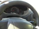 dashboard of a car with a steering wheel and a speedometer