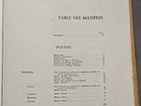 an open book with a list of items on it on a table