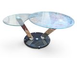 two glass tables with metal legs on a white surface