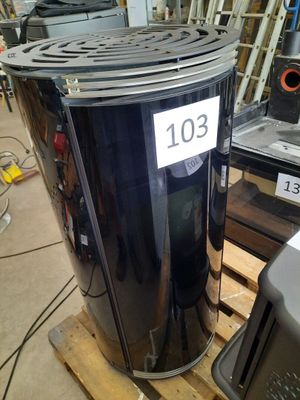 an image of a black trash can on a pallet in a warehouse