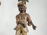 pair of antique bronze figurines of a man and a woman