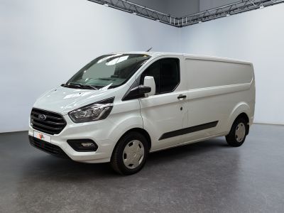 the white van is parked in a large room with a gray floor
