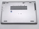 the bottom of a silver laptop with a small hole in the middle