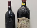 two bottles of wine sitting next to each other on a table