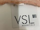 a close up of a label on a pink dress