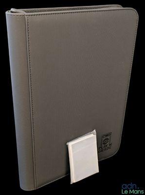 an image of a gray wallet with a white button on it