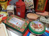 many different tins on a table with various tins