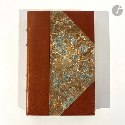 leather bound book with gold and blue flowers on a white background