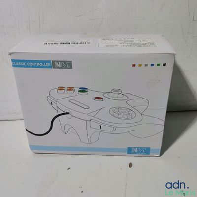a box with a game controller in it sitting on a table