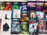 a lot of books that are sitting on a table