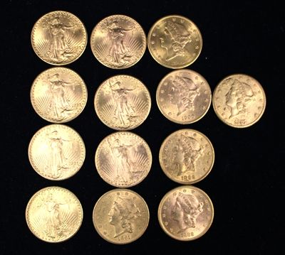 a lot of coins that are on a black surface
