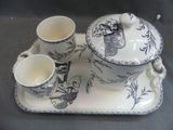 a picture of a tea set with two cups on a tray