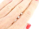 an image of a woman ' s hand with a red manicured nail polish and a diamond ring