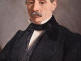 portrait of an old man in a black coat and white shirt