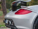 a silver sports car parked on the side of the road