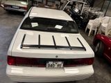 a white car that is parked in a garage